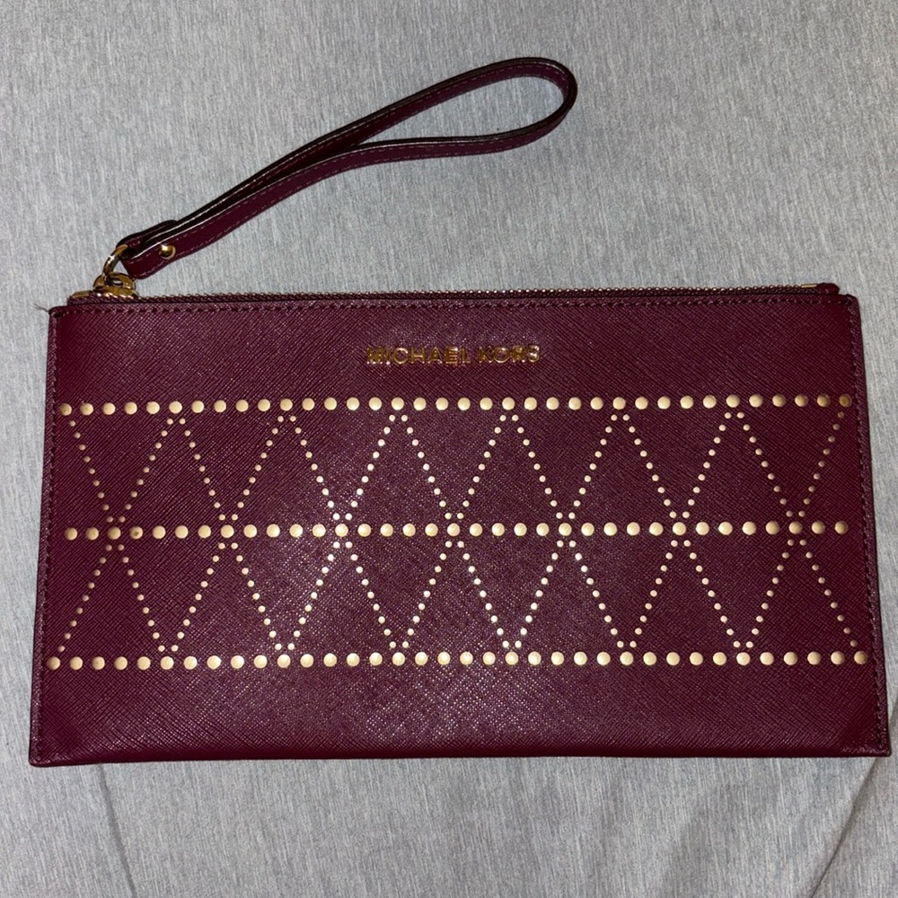 Authentic Michael Kors perforated clutch wristlet
